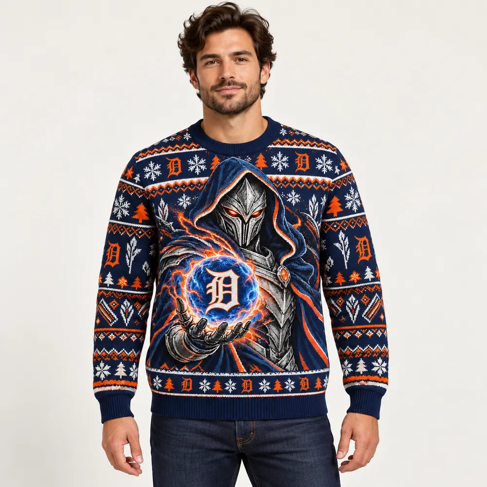 Editorial styling mockup of a model wearing the Detroit Tigers navy and orange Christmas sweater with silver armored figure and team orb