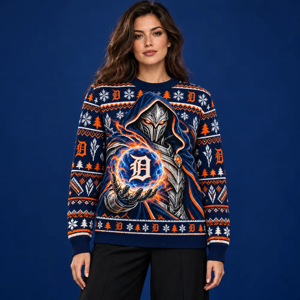 Editorial styling mockup of a model wearing the Detroit Tigers navy and orange Christmas sweater with silver armored figure and team orb