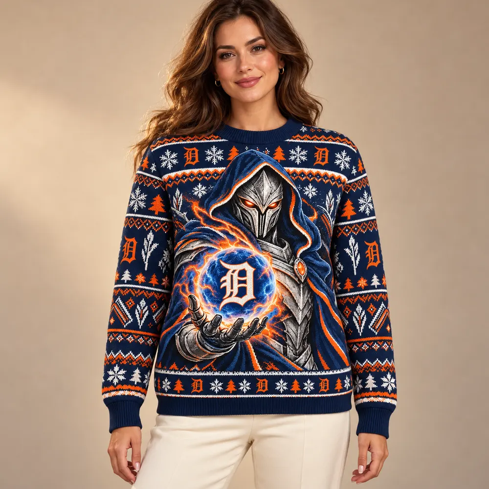 Editorial styling mockup of a model wearing the Detroit Tigers navy and orange Christmas sweater with silver armored figure and team orb